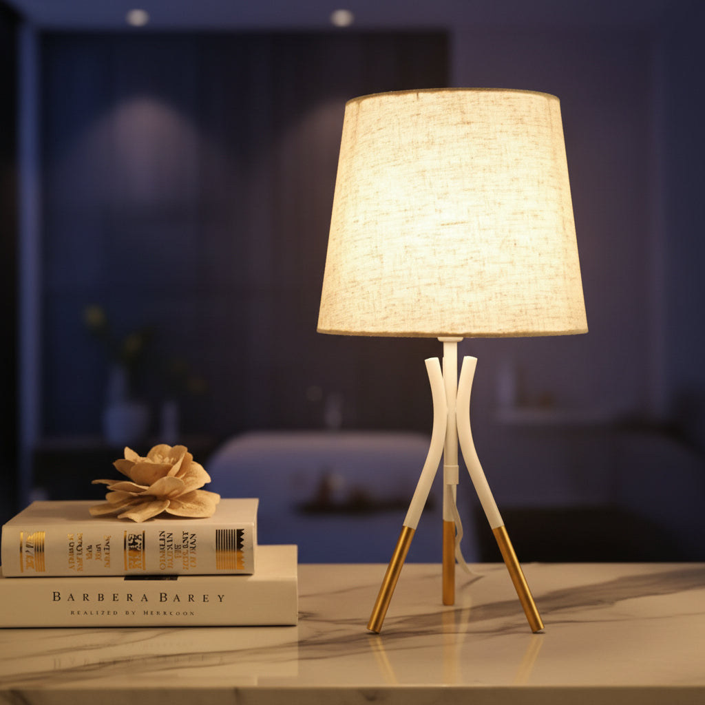 3-legged white and gold metal lamp